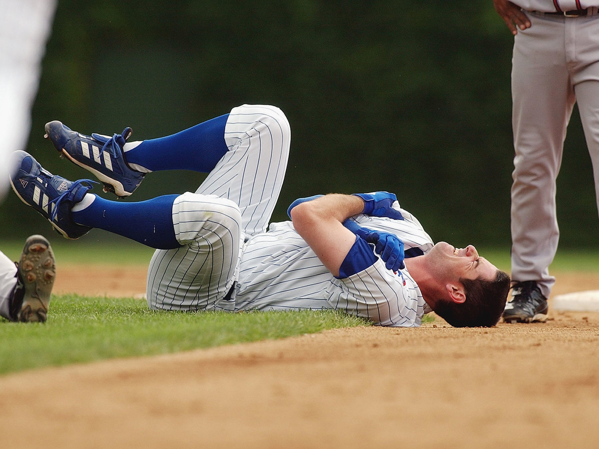 Mark Prior holds his shoulder after a violent 2003 collision with Marcus Giles.