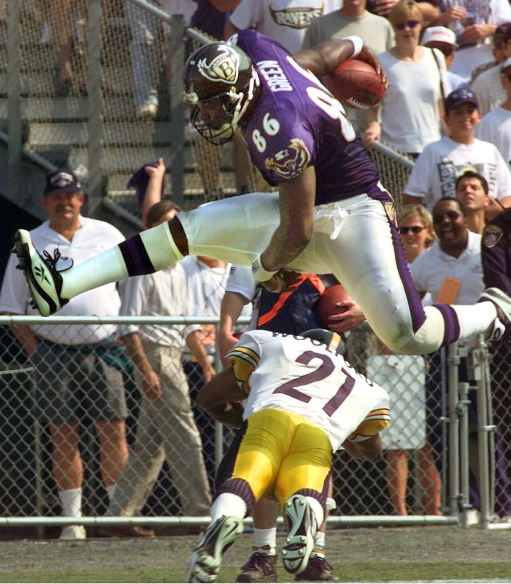 Eric Green goes high over Donnell Woolford in a 1997 game at old Memorial Stadium. 