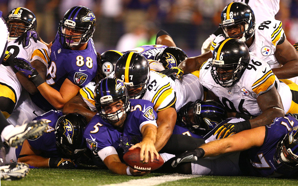 Joe Flacco reaches for six, September 2014.