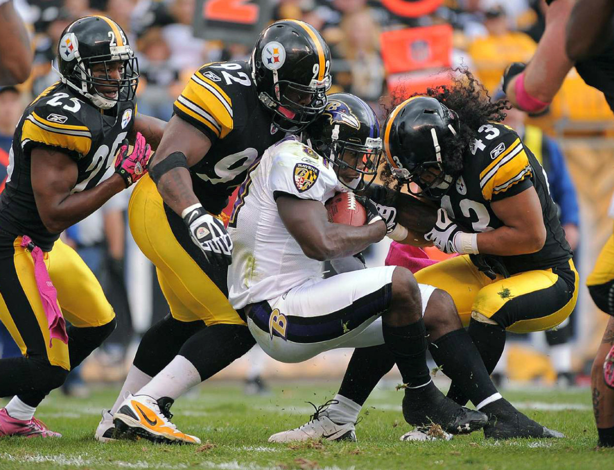 Ryan Clark, James Harrison and Troy Polamalu crunch Anquan Boldin, October 2010.