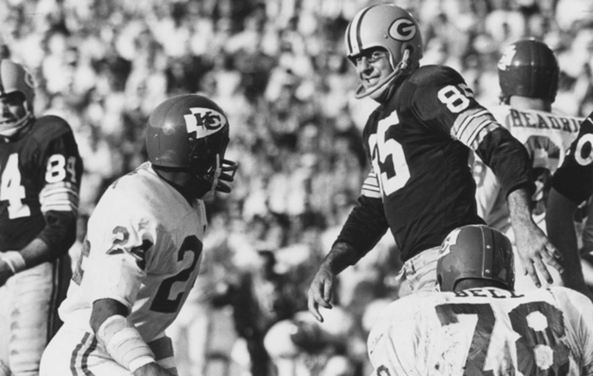 Packers WR Max McGee (85) puts Chiefs CB Fred "The Hammer" Williamson (24) in his place. 