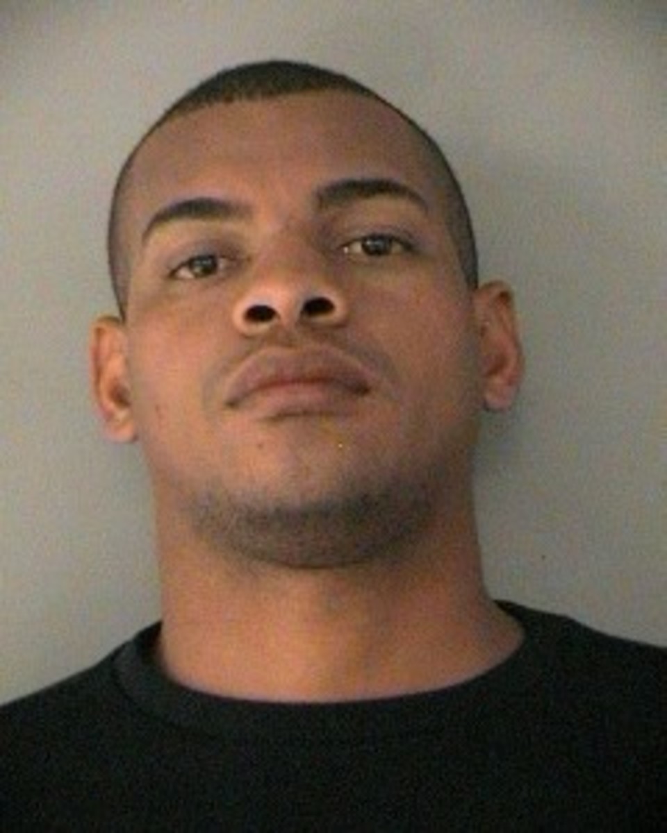 This booking photo provided by the Arlington County, Va., Police Department shows Atlanta Braves baseball outfielder Hector Olivera. Olivera was placed on paid administrative leave by Major League Baseball after he was arrested when a woman accused him o