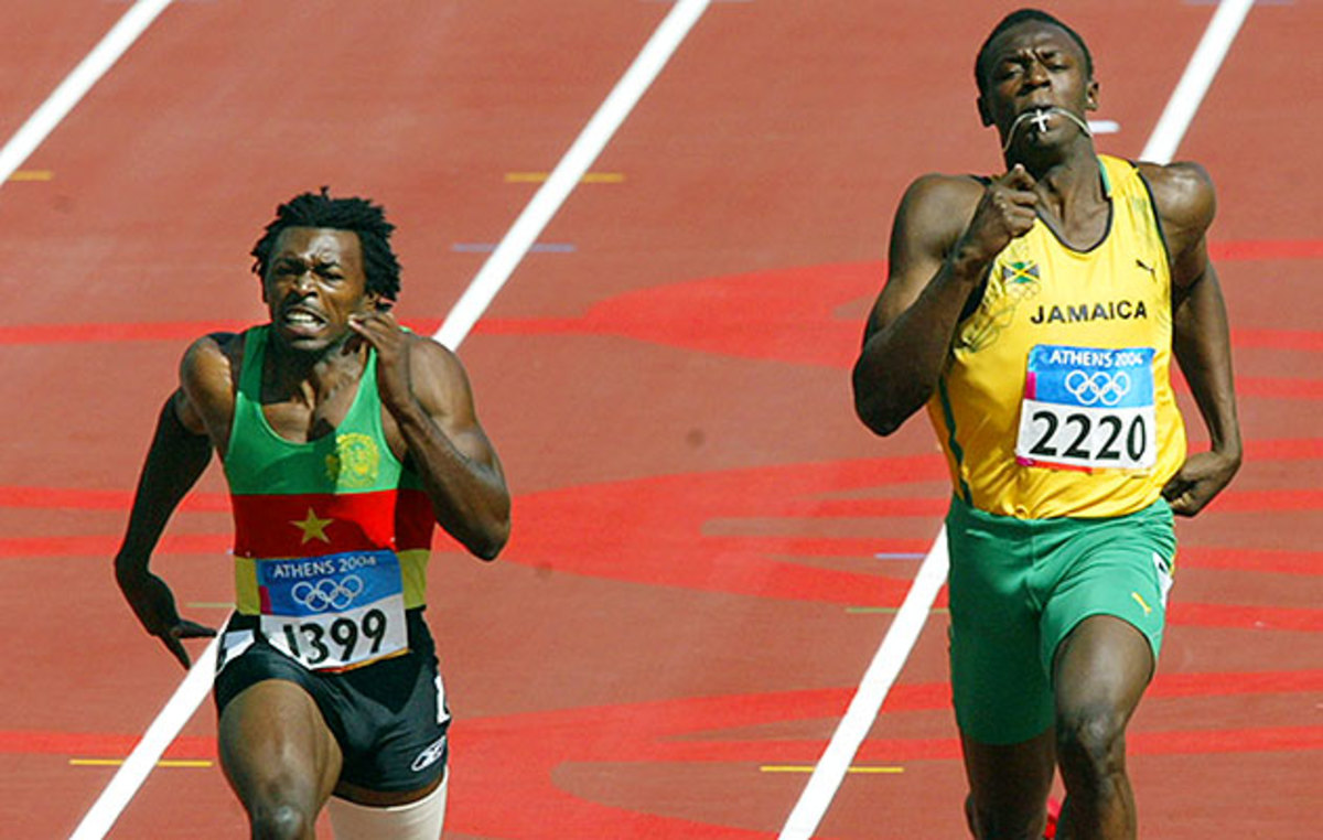 At the 2004 Olympics, Usain Bolt (right) runs next to Joseph Batangdon of Cameroon in the first round of the 200 meters.