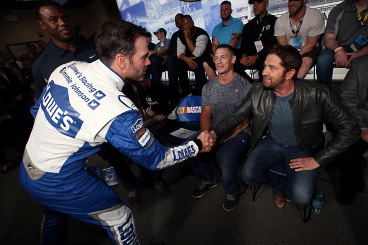 Jimmie Johnson greets Grand Marshal Gerard Butler.