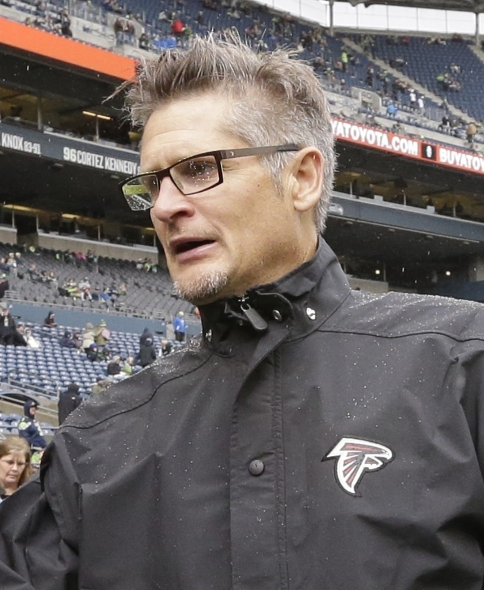 FILE - In this Oct. 16, 2016, file photo, Atlanta Falcons general manager Thomas Dimitroff stands on the field before an NFL football game against the Seattle Seahawks, in Seattle.  Dimitroff has signed a three-year contract extension with the Atlanta Fal