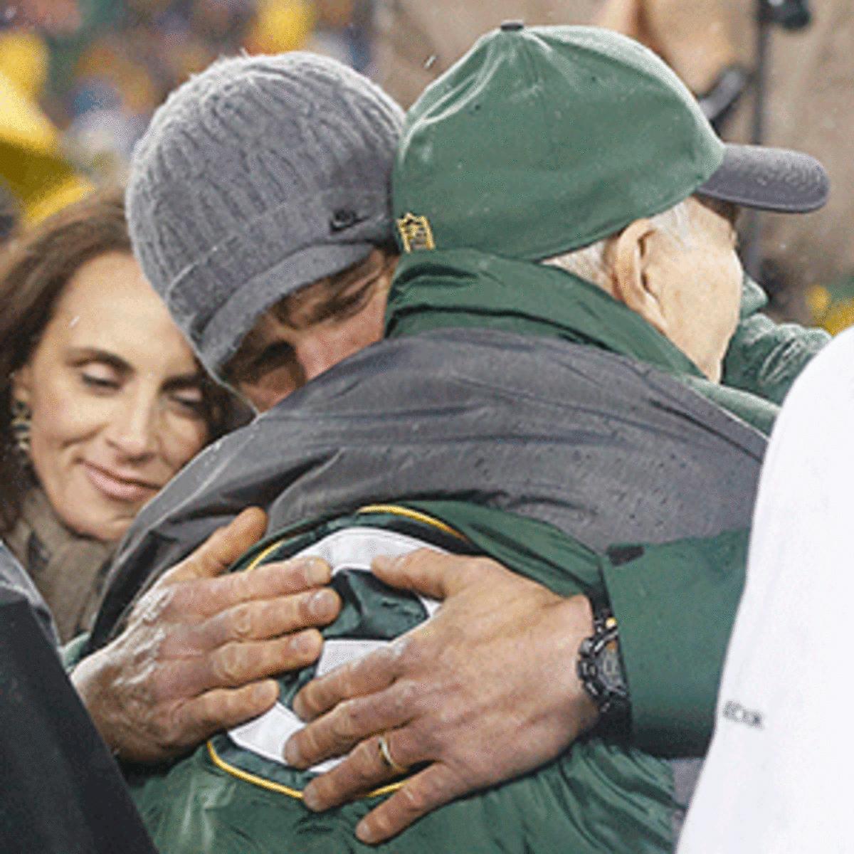 Brett Favre embraces Bart Starr at his number retirement ceremony. 