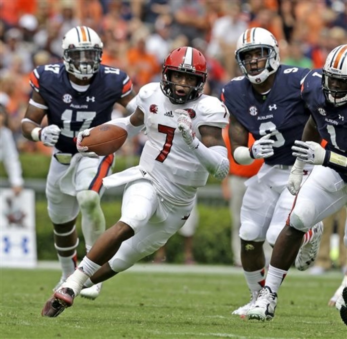 Jacksonville State quarterback Eli Jenkins (7) scrambles for a first down during the second half of an NCAA college football game against Auburn, Saturday, Sept. 12, 2015, in Auburn, Ala. (AP Photo/Butch Dill)