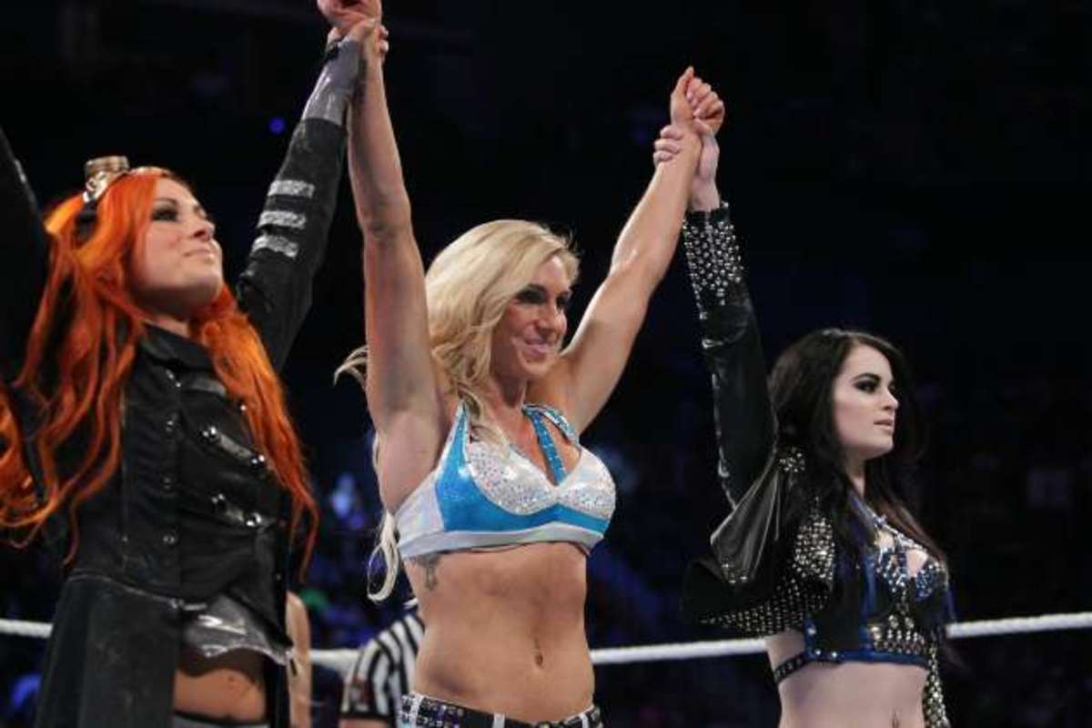NXT wrestlers (L to R) Becky Lynch and Charlotte with WWE’s Paige