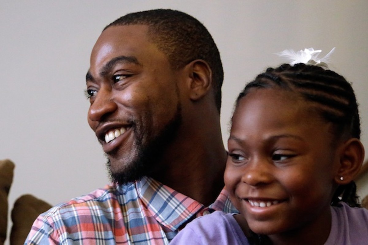 Adrian Arrington with his daughter in 2015. 