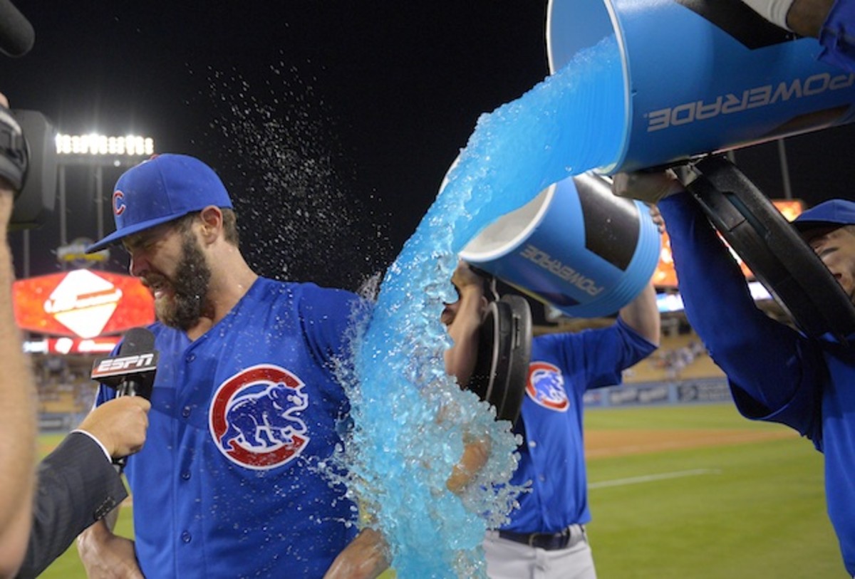 Arrieta gets a present from his teammates following his first career no-hitter. 