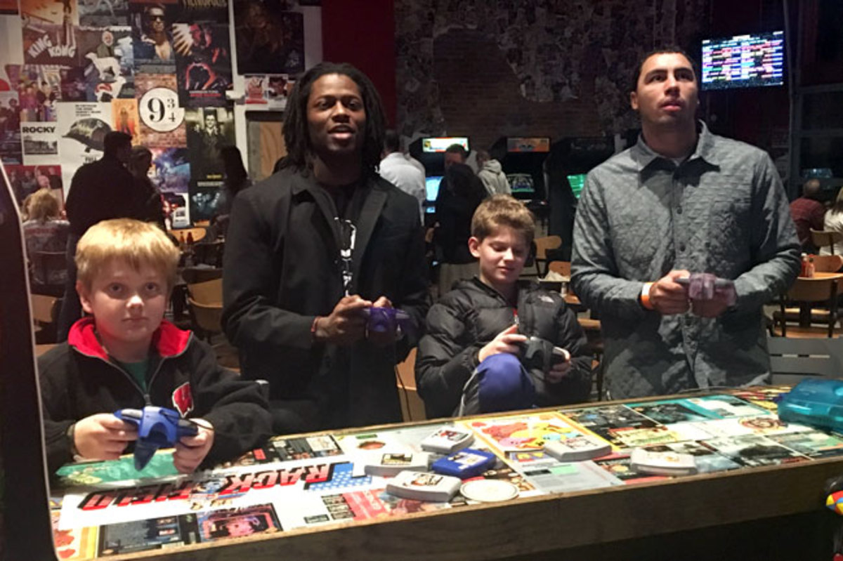 Conley (second from l.) played video games with kids and fellow Chiefs rookie Ross Travis while waiting for the latest Star Wars film to start.