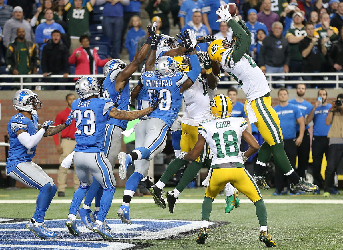 Richard Rodgers high-points the football in front of Lions defenders to secure the Packers' miraculous win.