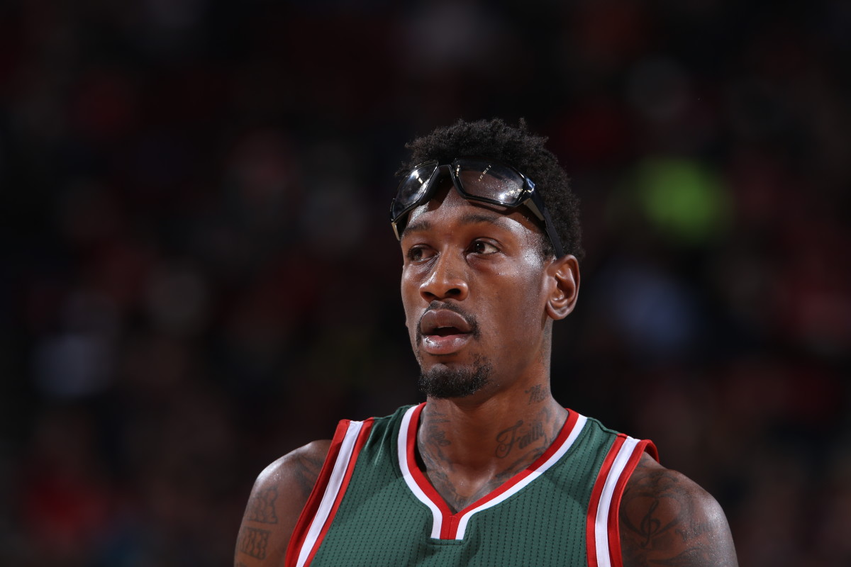 Milwaukee Bucks center Larry Sanders joins teammates on bench during