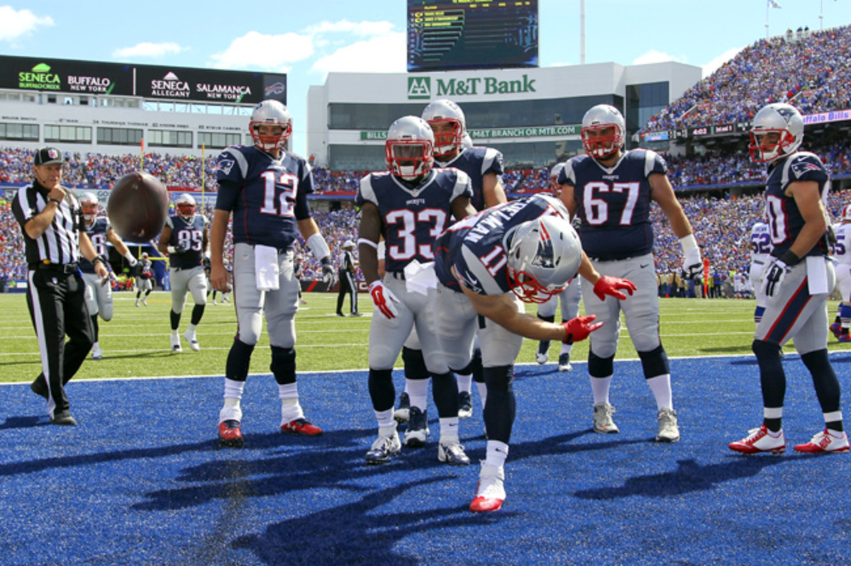 The Patriots’ offense spent plenty of time celebrating on Sunday after rolling up 40 points and more than 500 yards on Rex Ryan’s Bills. But that’s not the only reason they’re No. 1. (Bill Wippert/AP)