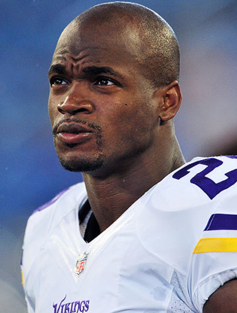 If reinstated, Adrian Peterson is scheduled to earn $12.75 million in 2015. (Ronald C. Modra/Getty Images)