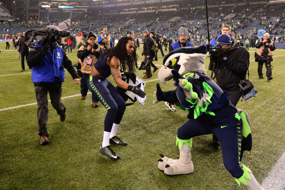 Sherman and a pal postgame. (Robert Beck/Sports Illustrated/The MMQB)