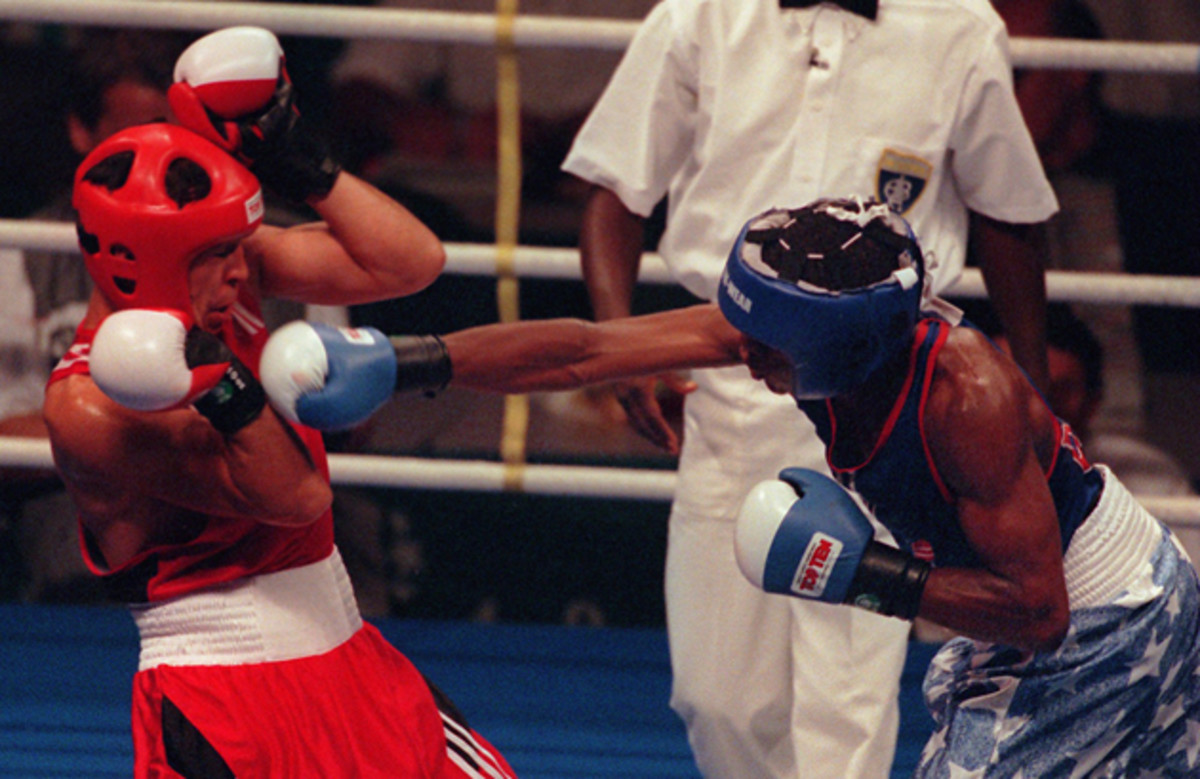 Mayweather hammers Bakhtiyar Tileganov 1996 in Atlanta. Mayweather went on to win the preliminary bout.