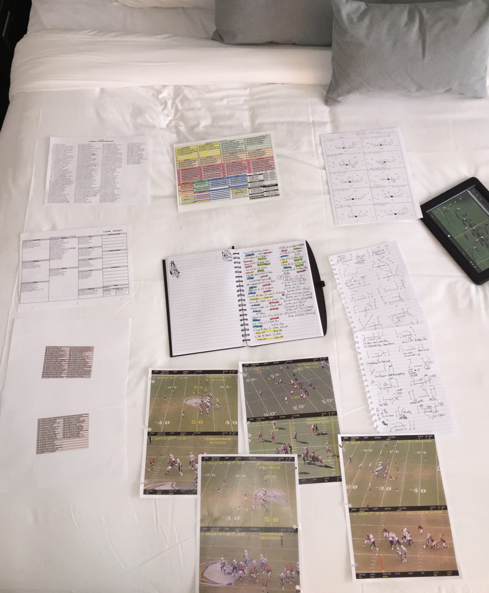 The day before the Browns game, Palmer has his study materials all set up in his Cleveland-area hotel room. 