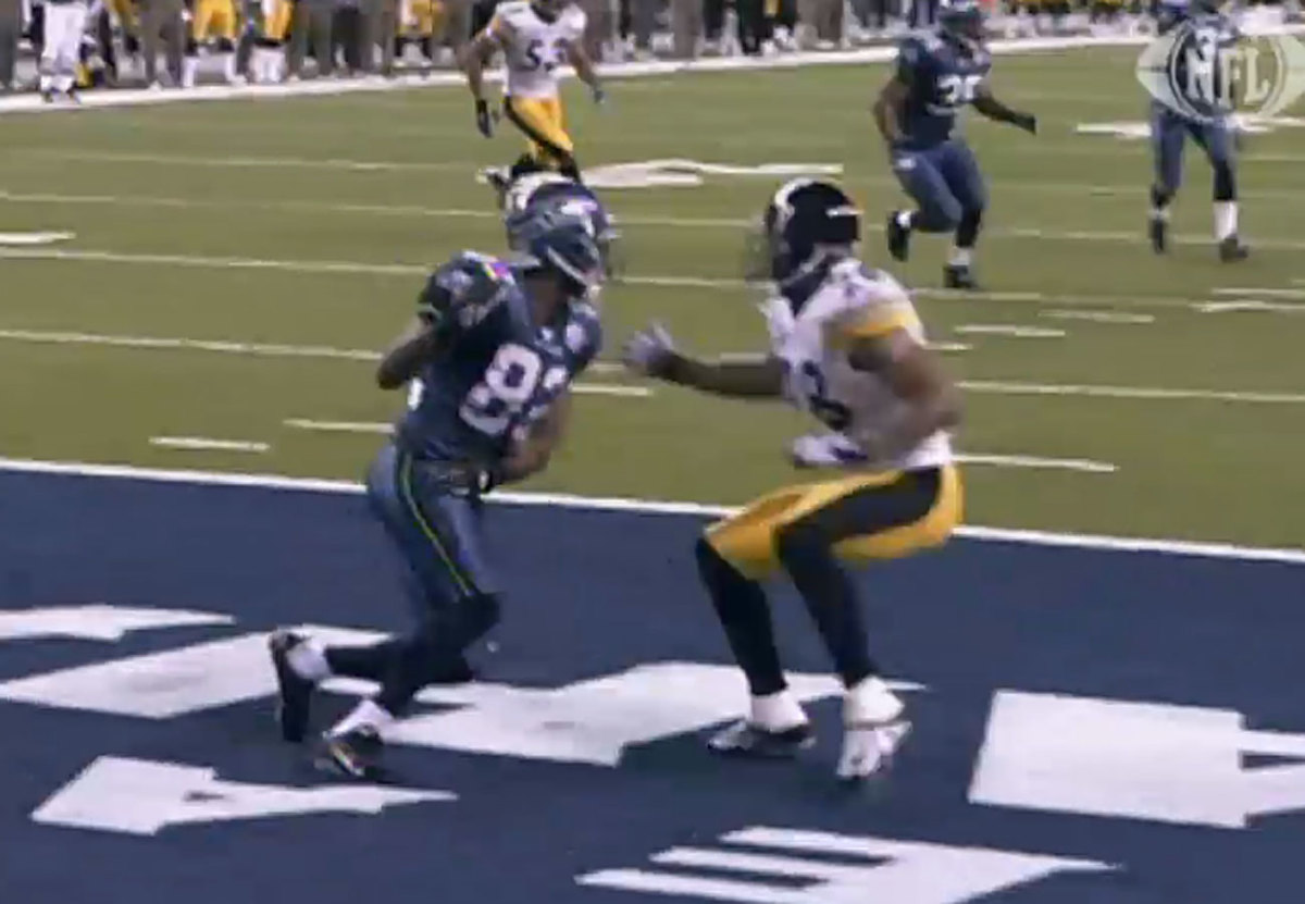 Jackson and McFadden lock up in the endzone.