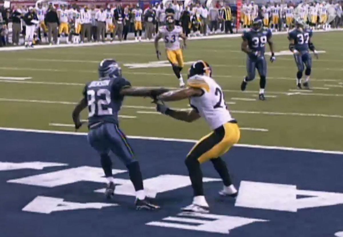 He extends his left arm, throwing McFadden off balance.