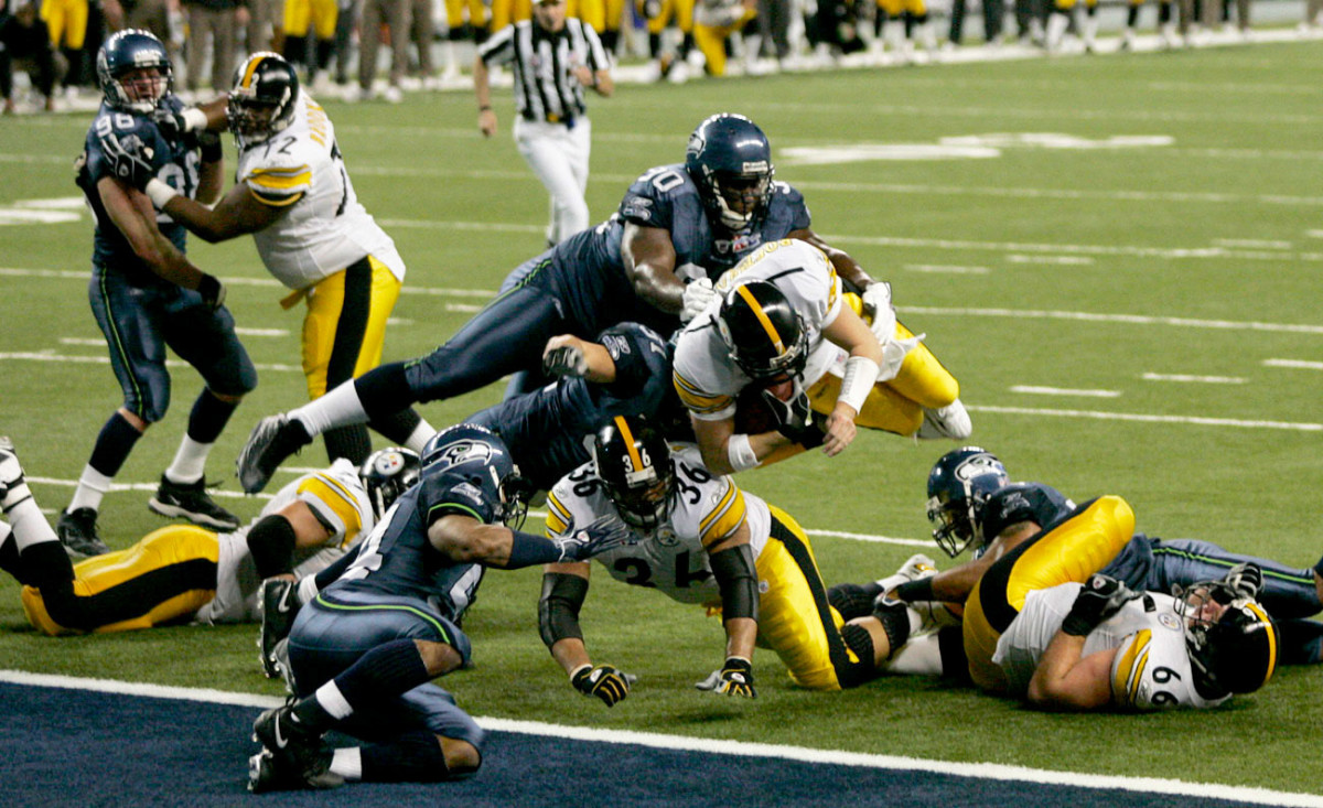 Roethlisberger goes airborne in search of the goal line.