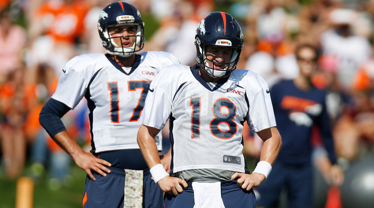 Peyton Manning and Brock Osweiler (Photo by David Zalubowski/AP)