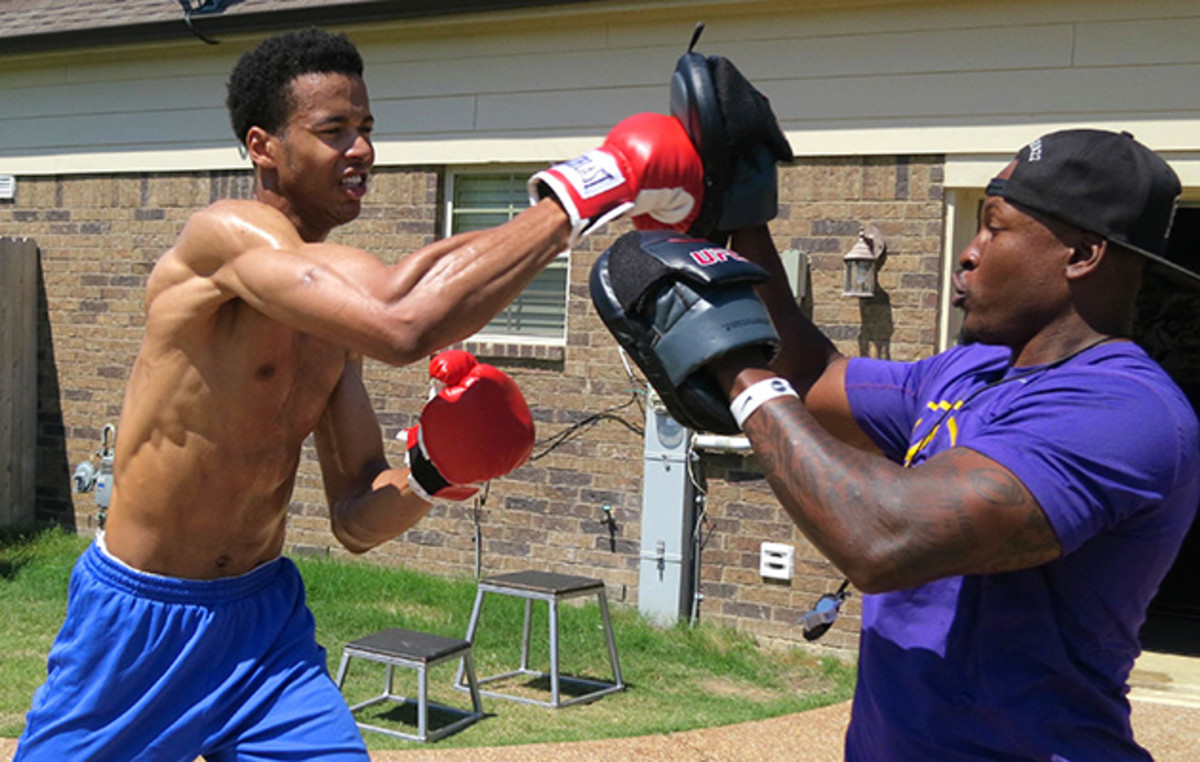 Labissiere boxing with trainer Raheem Shabazz at Shabazz's house in Cordova, Tenn., in June.