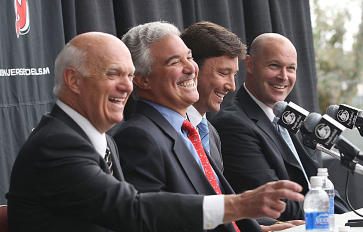 (Left to right) Devils GM Lou Lamoriello, owner Jeff Vanderbeek, Ilya Kovalchuk and coach John MacLean at the press conference announcing the big contract.