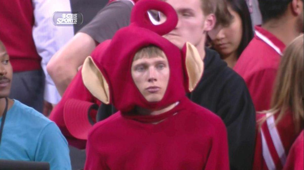 Wisconsin Teletubby sad and playing flute after loss Sports Illustrated