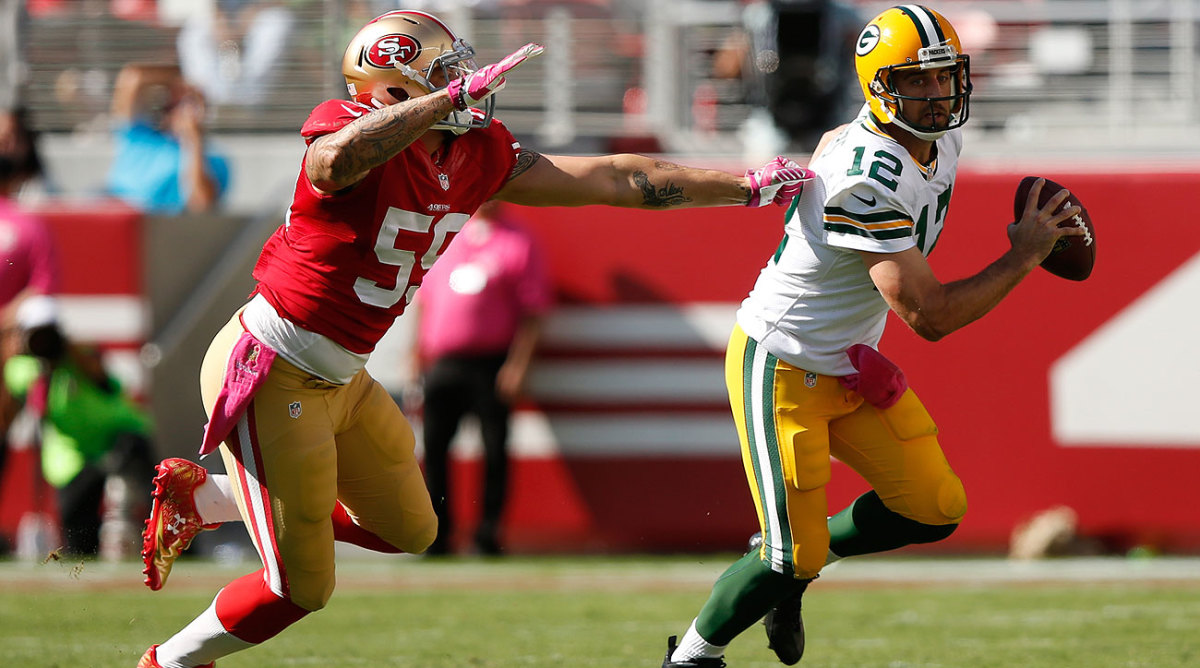 Opponents have had a hard time getting to Aaron Rodgers this season. (Ezra Shaw/Getty Images)