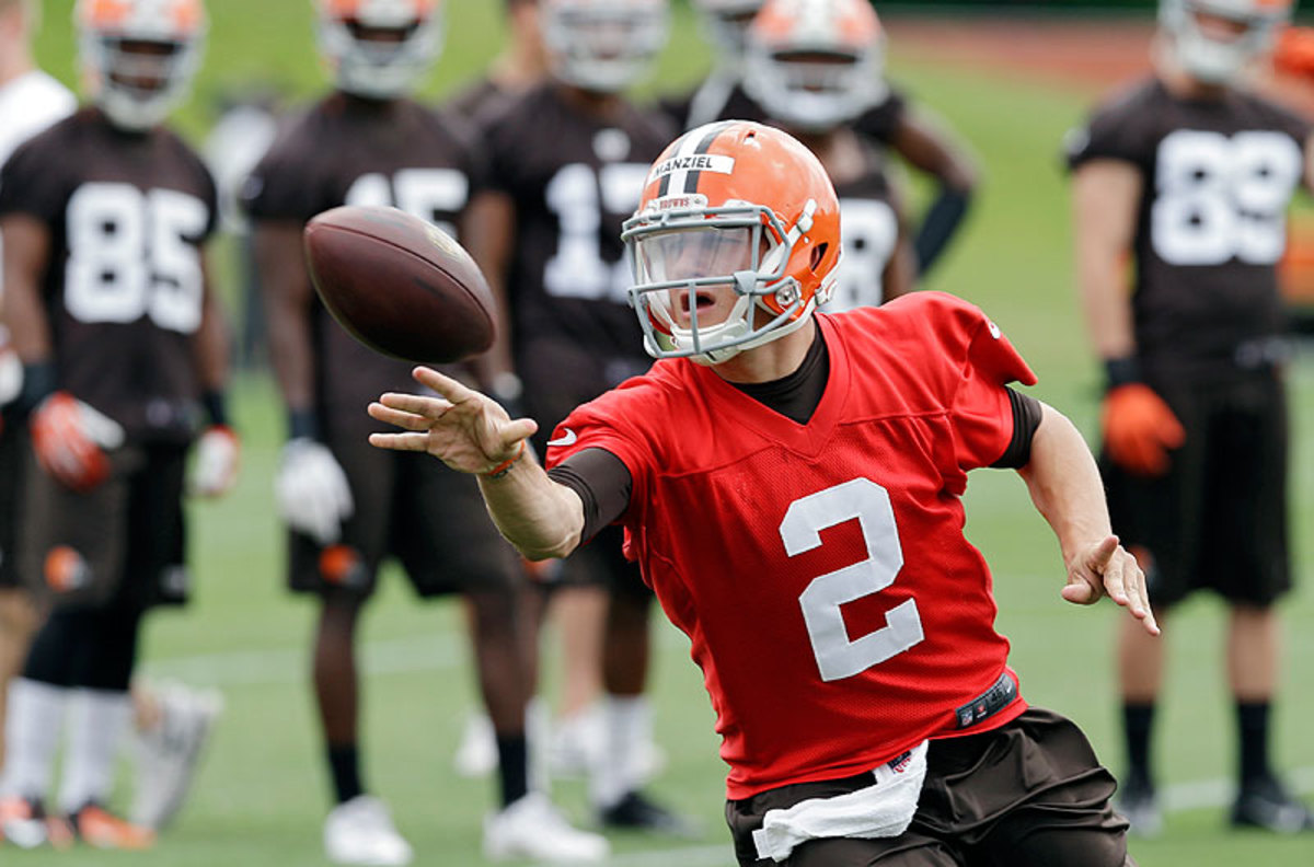 Manziel drew headlines off the field, but at the Browns facility, teammates have vouched for the rookie quarterback's work ethic and eagerness to learn. (Marc Duncan/AP)