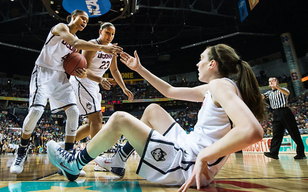 Breanna Stewart gets a hand from teammates Moriah Jefferson (4) and Kaleena Mosqueda-Lewis.