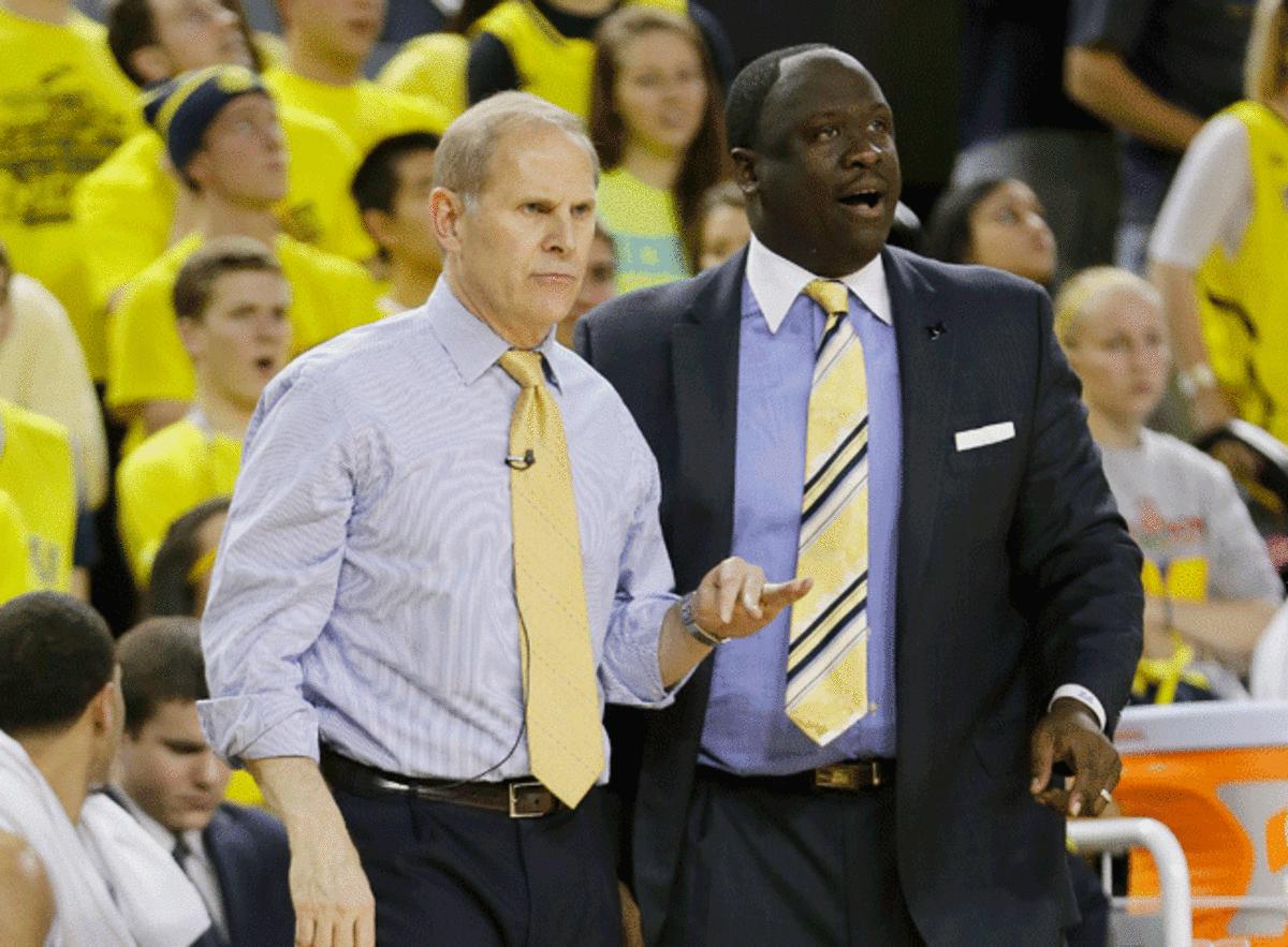 One reason why Michigan coach John Beilein (left) has been so successful is his ability to defer to assistants like Bacari Alexander (right).