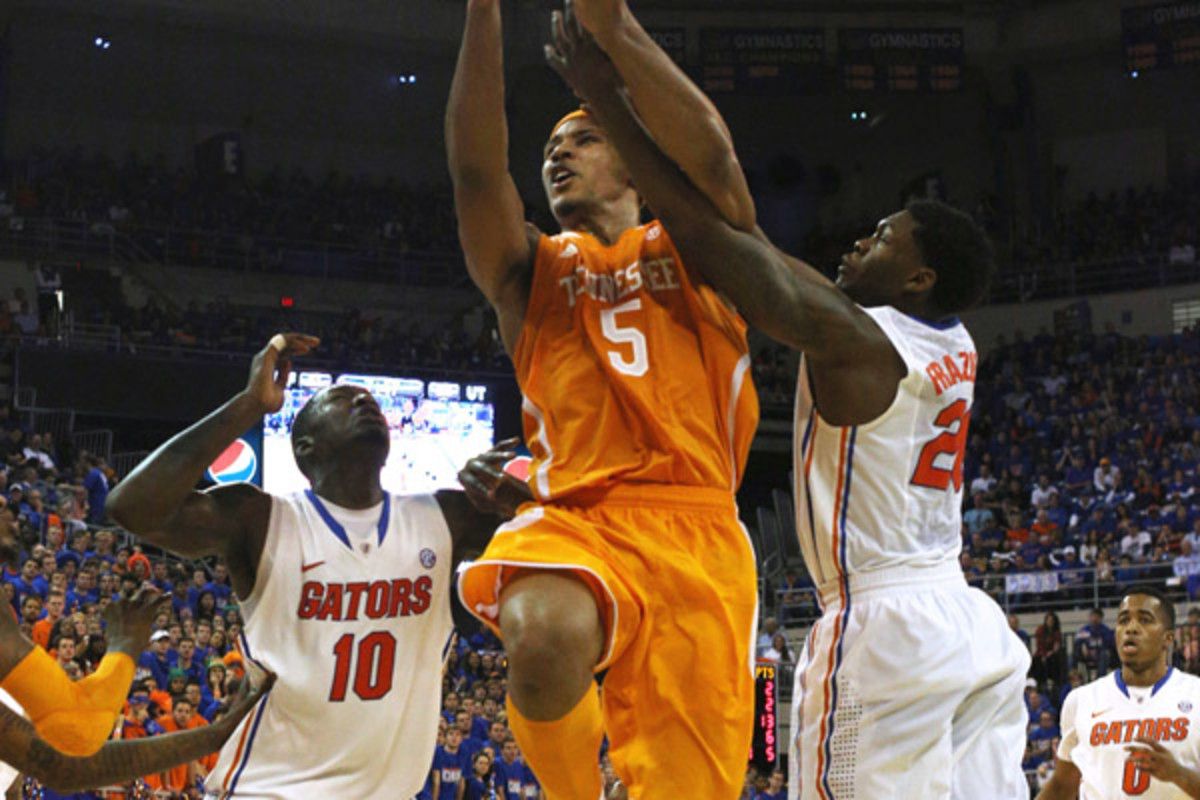 Dorian Finney-Smith (10) and Michael Frazier II helped the Gators keep Jarnell Stokes and the Volunteers off balance all game. 