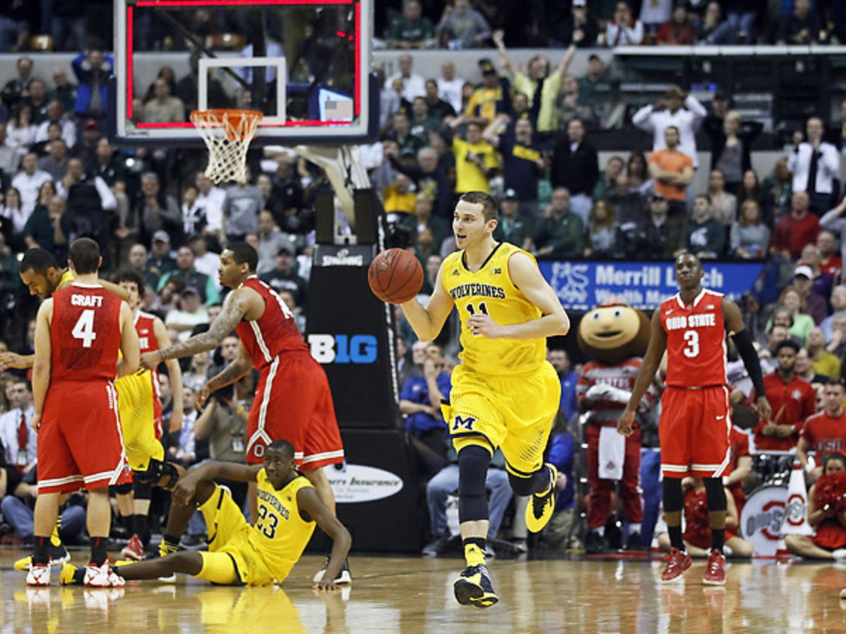 Michigan's Nik Stauskas dribbles out the Wolverines' thrilling win over Ohio State. (Kiichiro Sato/AP)