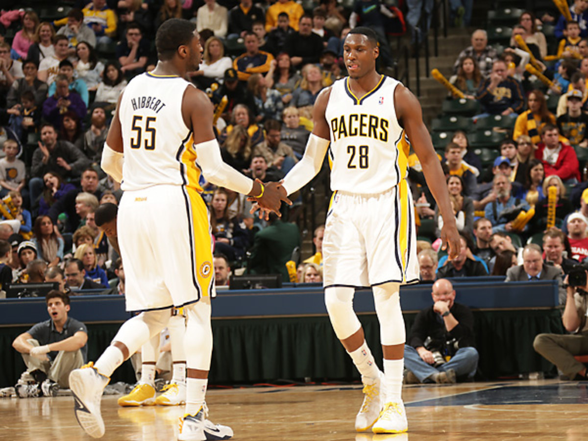 Roy Hibbert (left) and Ian Mahinmi will be headed to the playoffs after clinching a spot on Wednesday. (Ron Hoskins/Getty Images)