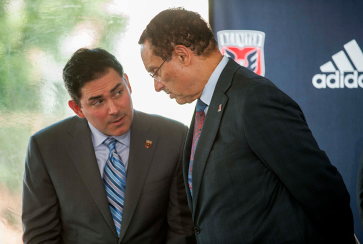 D.C. United managing partner Jason Levien, left, speaks with D.C. mayor Vincent Gray.