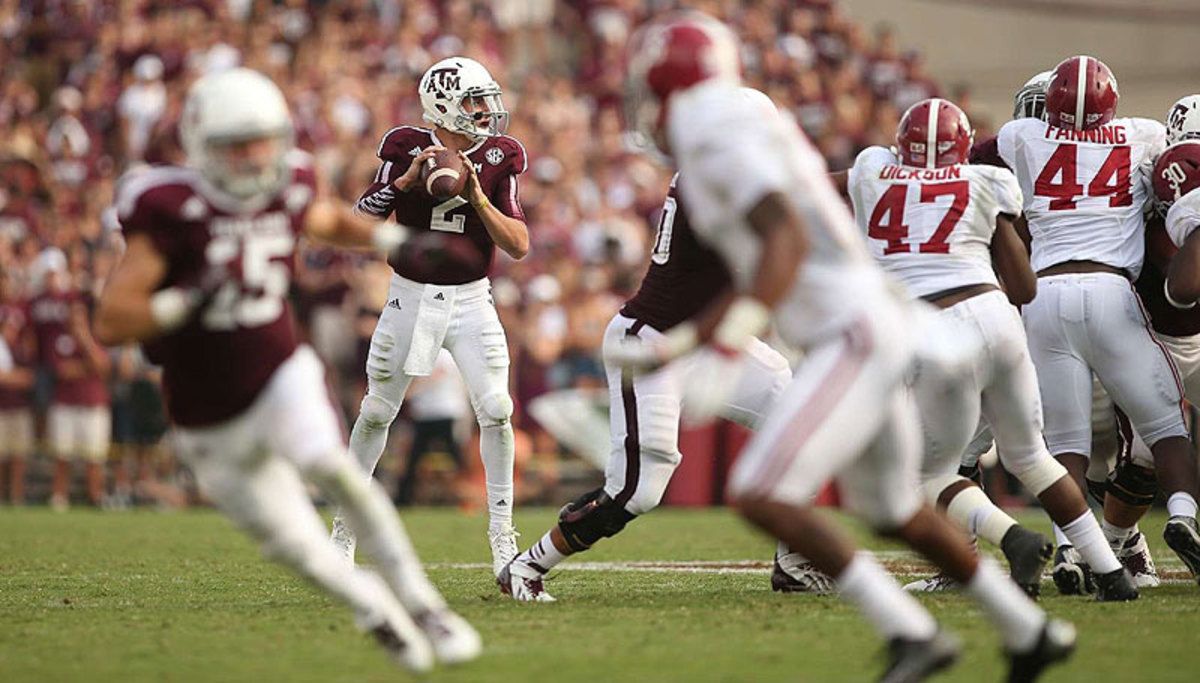 Standing tall in the pocket is something NFL teams will want Johnny Manziel to prove he can do at the next level. (Darren Carroll/SI)