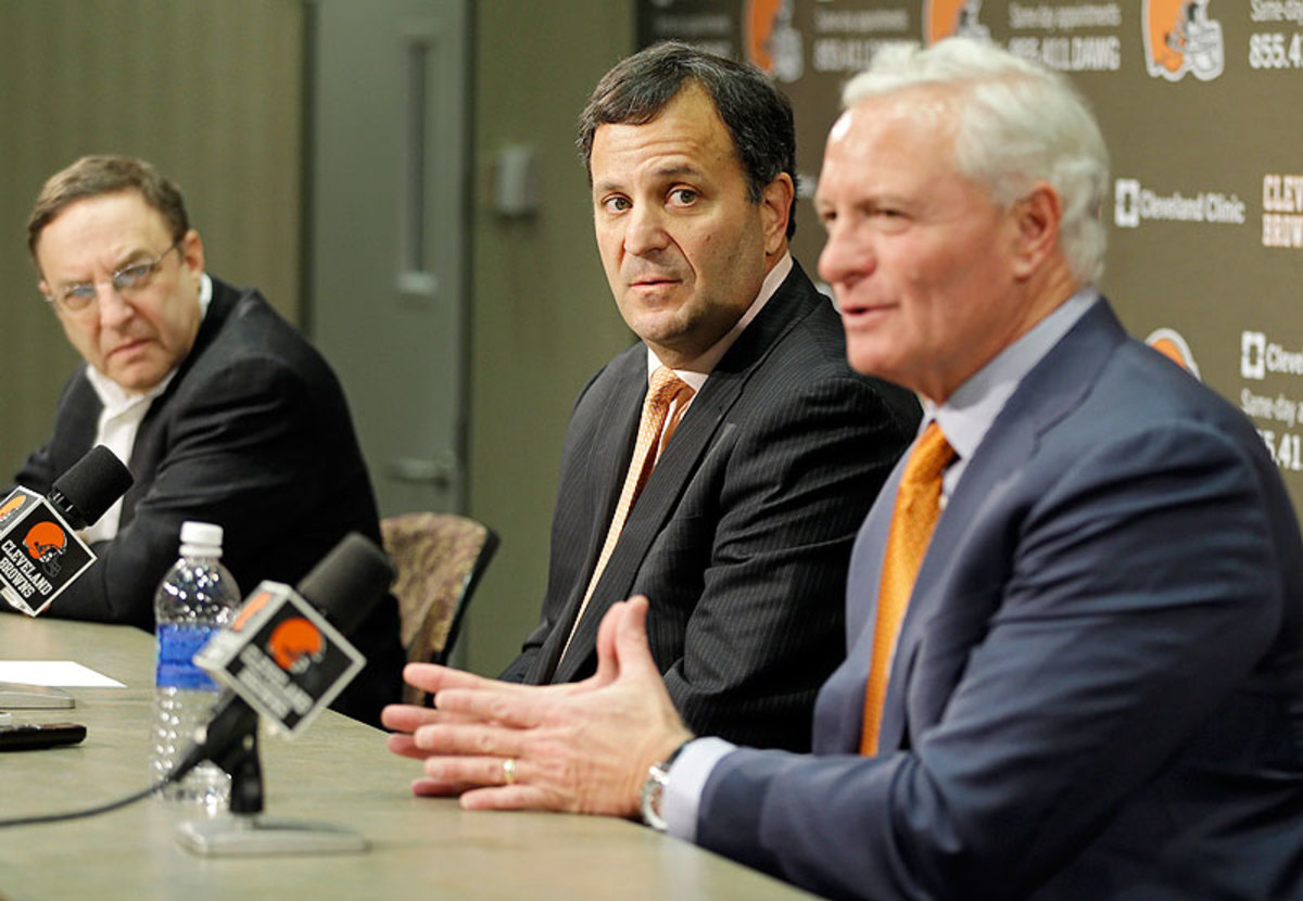 Mike Lombardi (center) rarely addressed the media, with Joe Banner and Jimmy Haslam speaking about the Browns' front-office decisions. (Mark Duncan/AP)