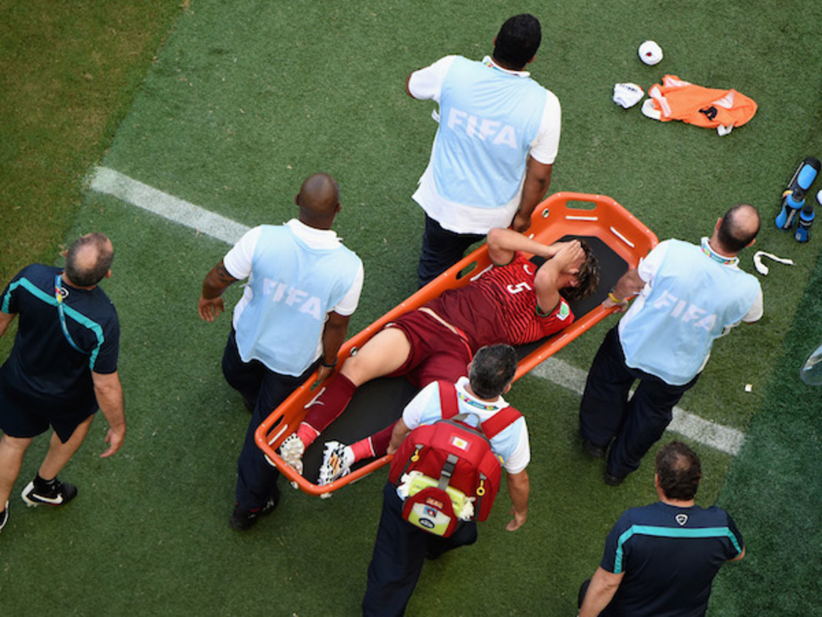 Fabio Coentrao left yesterday's game on stretcher and fears he is done for the tournament. (Getty)