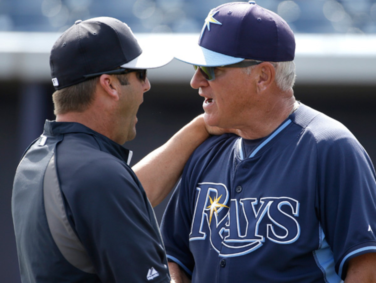 Joe Maddon (right) may have found a loophole in MLB's instant replay rule.