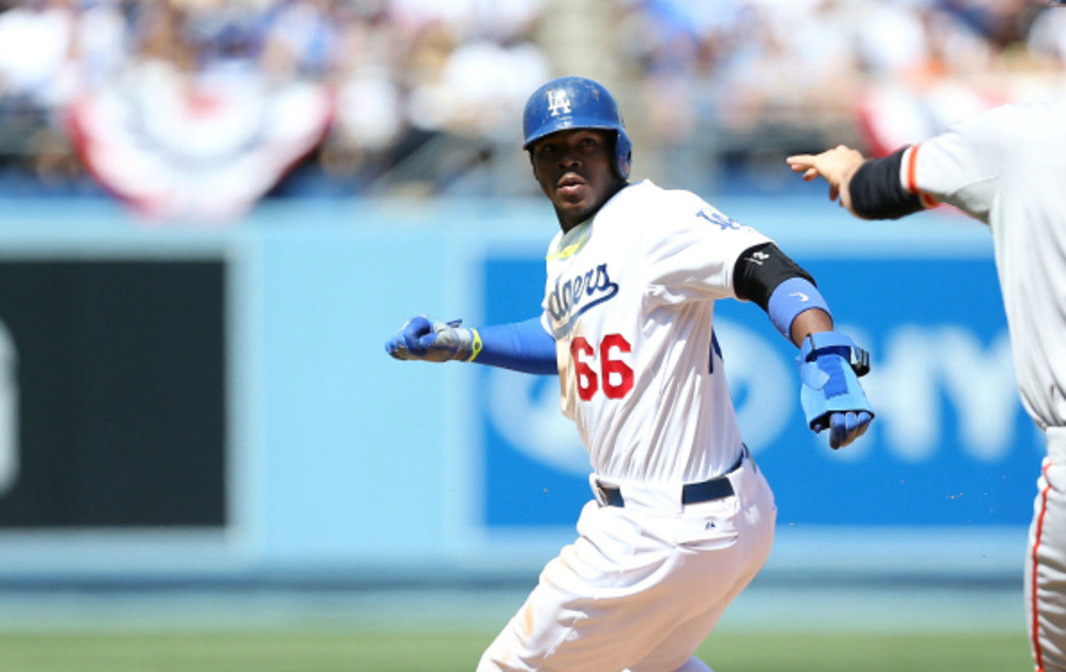 Yasiel Puig was pulled from the lineup on Friday after arriving late to the ballpark. (Victor Decolongon/Getty Images)