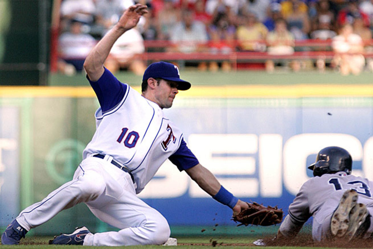 Michael Young (left), who will be honored by the B.A.T. on Tuesday, has kept a far lower-profile than fellow perennial All-Star and one-time teammate Alex Rodriguez.