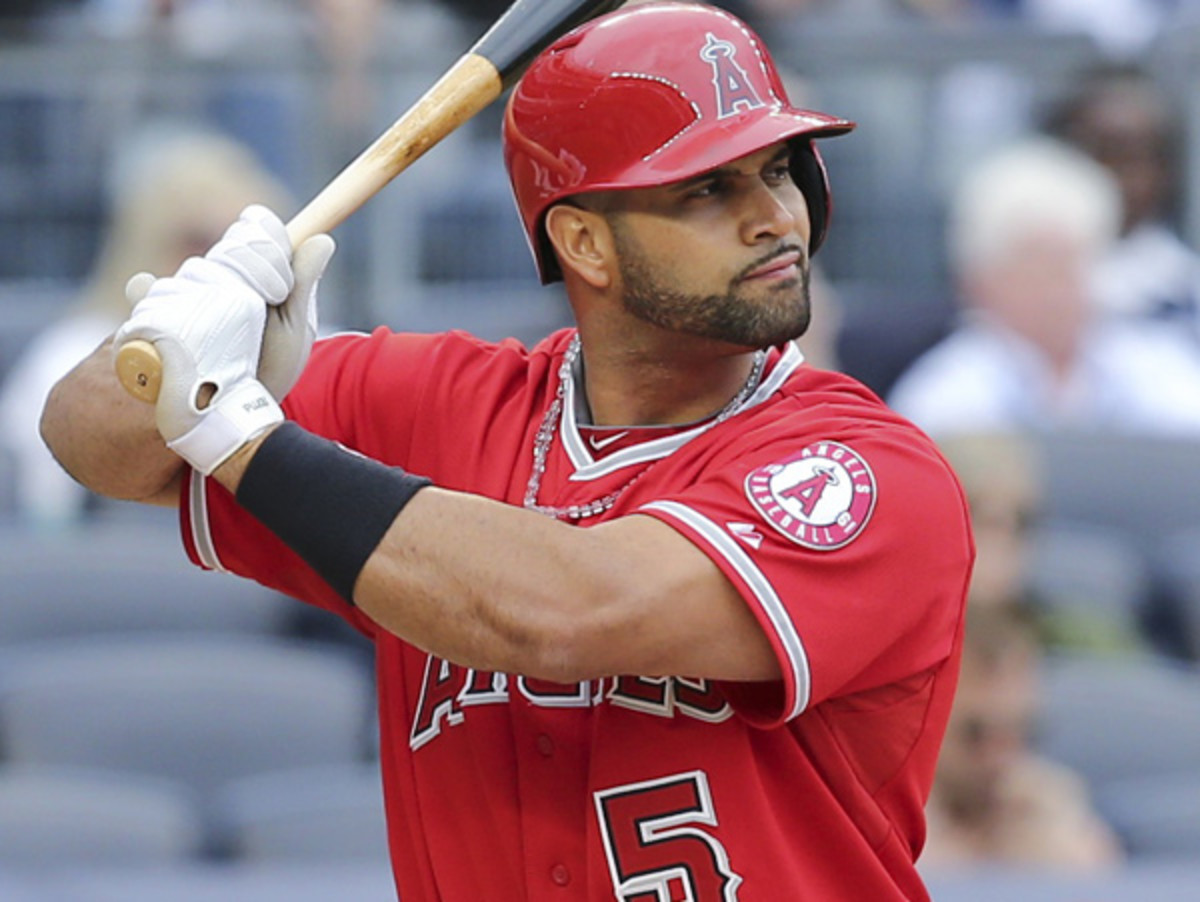 Albert Pujols has the third-most career homers hit by a Dominican-born player. (John Minchillo/AP)