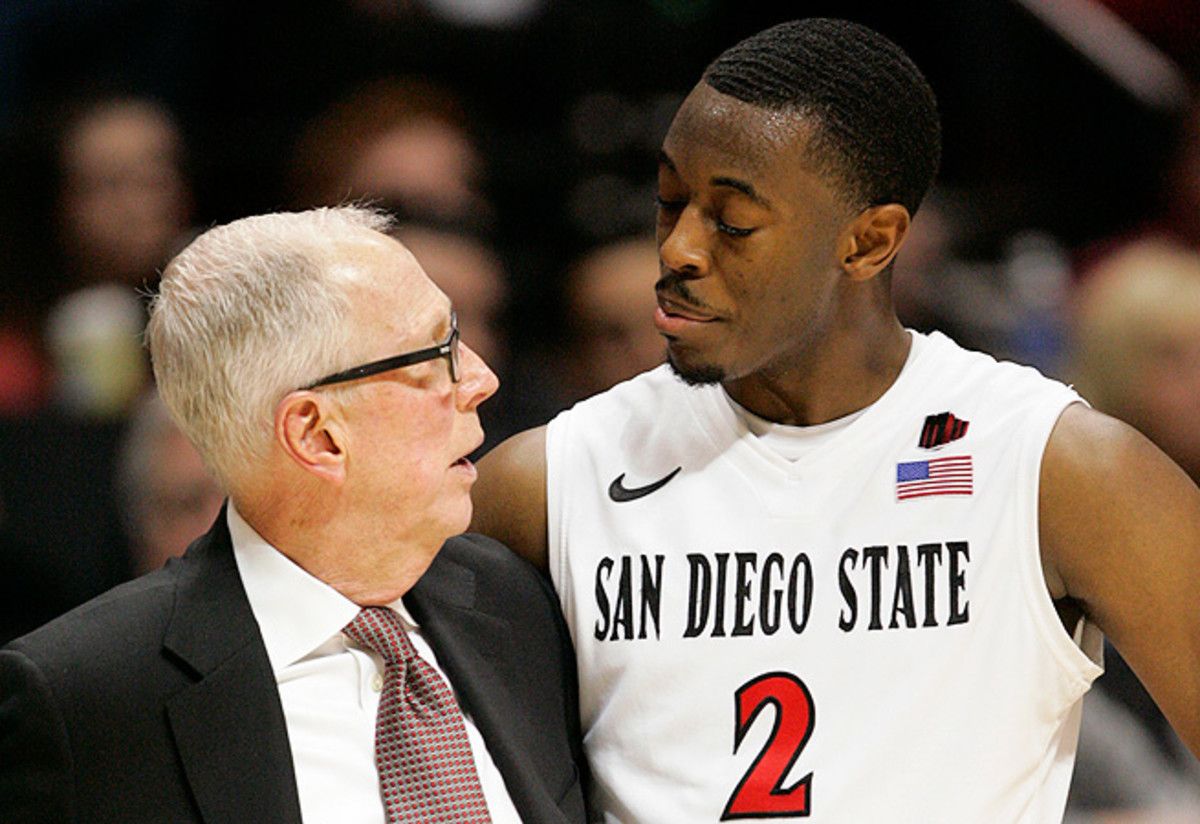 Steve Fisher speaks with leading scorer Xavier Thames, who has blossomed in his senior season.
