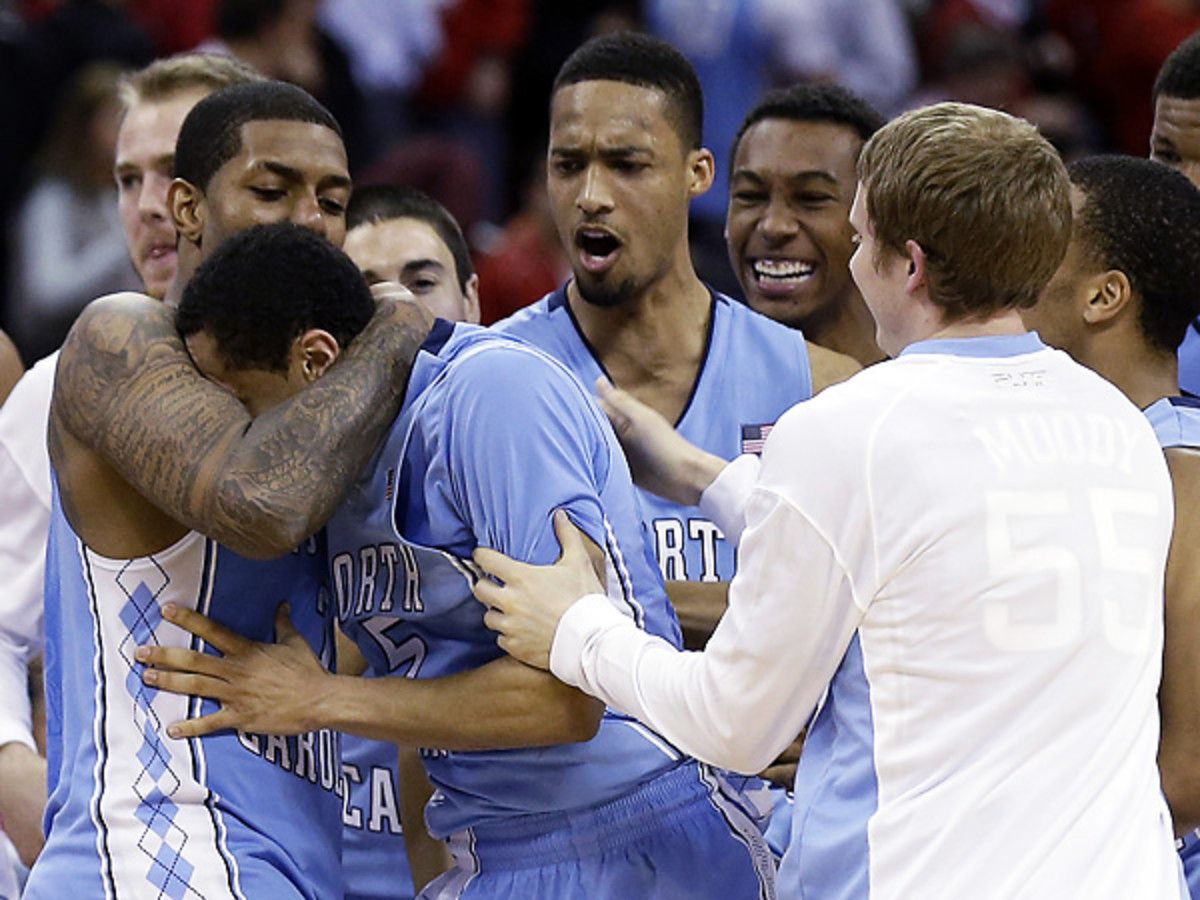 No. 19 UNC had plenty to celebrate after Marcus Paige (center) saved them from an upset in Raleigh. (Gerry Broome/AP)
