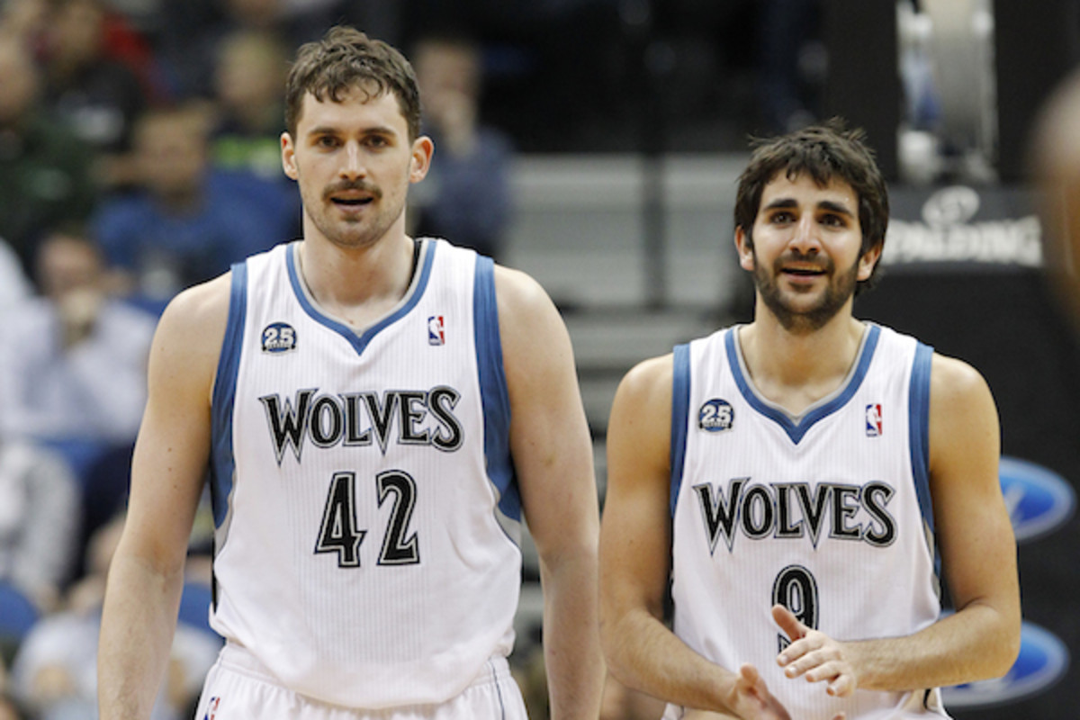 Kevin Love and Ricky Rubio stand on the court during the fourth quarter in a game against Utah (Ann Heisenfelt/AP)