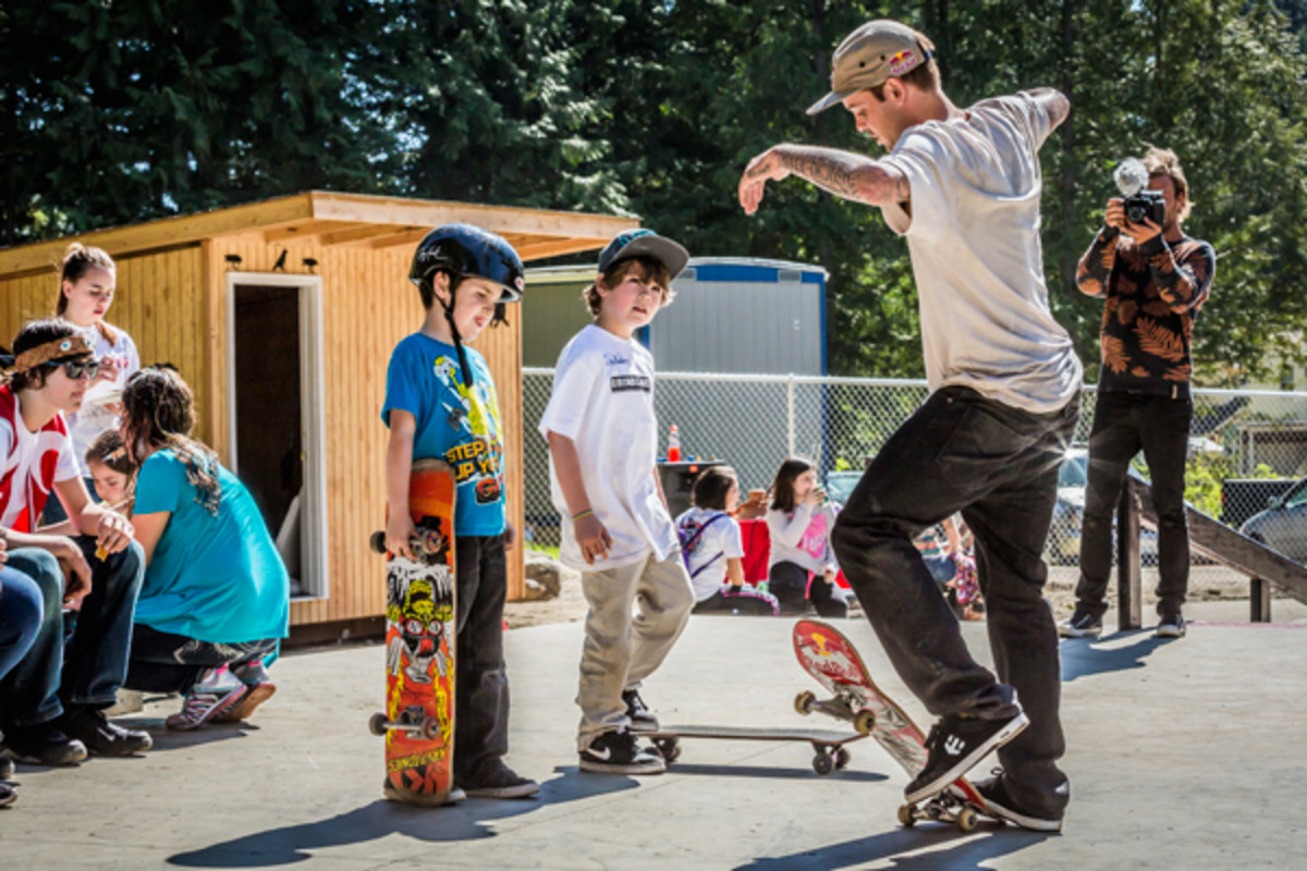 Ryan Sheckler teaches tribal youth how to ollie a skateboard at the Sheckler Foundation's Dedication of the S'klallam Tribe Skate Park in Kingston, WA.