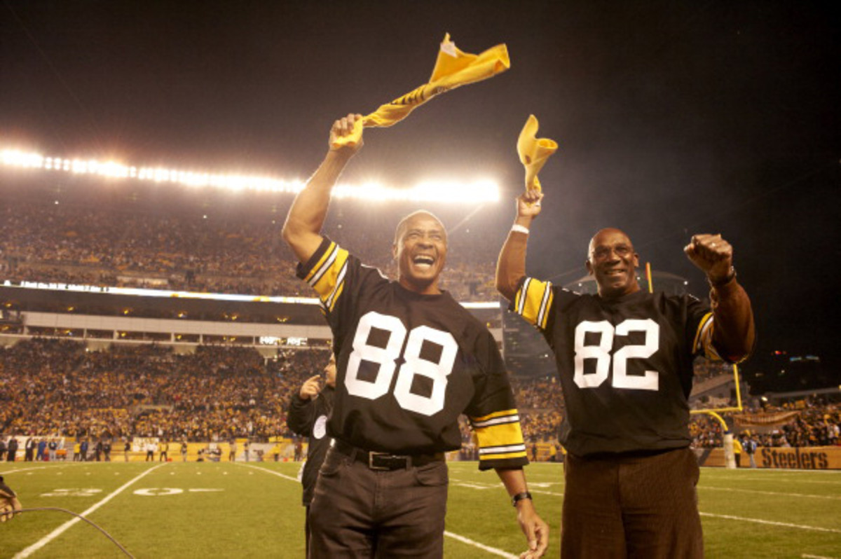Stallworth and Swann, who were both drafted by Pittsburgh in 1974, led the crowd in a Terrible Towel wave in a 2012 game.