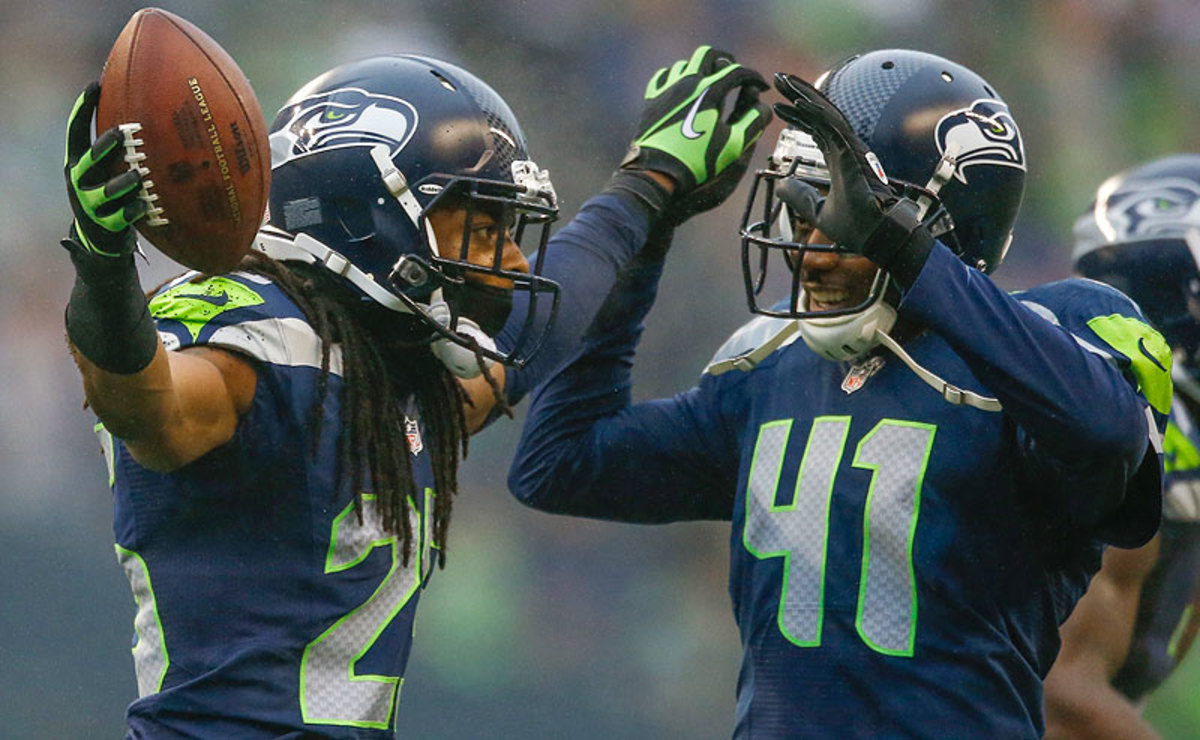 The play of entrenched starter Richard Sherman (left) and fill-in cornerback Byron Maxwell helped the Seahawks have the No. 1 overall team defense and pass defense in the NFL this season. (Otto Greule Jr./Getty Images)